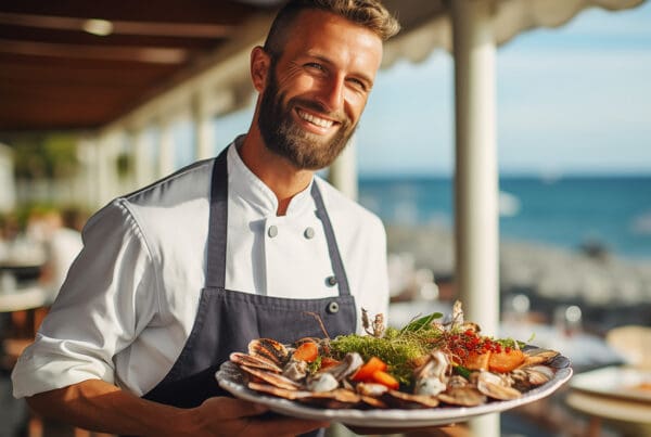 Insurance by Industry - Cheerful Chef Serving Lobster